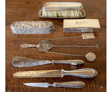 A collection of silver and white metal dressing table items including ring bxes, pen tray, brushes, letter opener and chatela