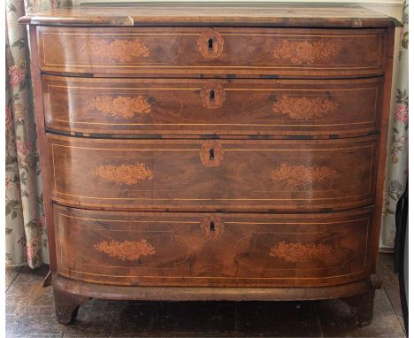An 18th Century Dutch figured walnut bowfront chest of drawers, strung and marquetry inlaid throughout with birds and foliage