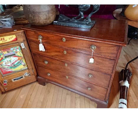 A George III mahogany chest,&nbsp;having three long drawers with brass ring handles and carrying&nbsp; handles to the sides, 