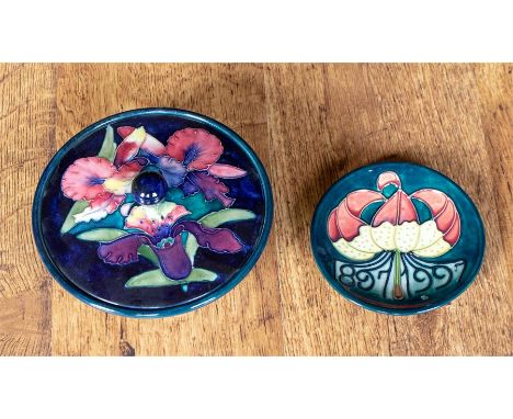 A 1950's/60's Moorcroft orchid pattern lidded pedestal sugar basin on a blue ground, 16cm by 16cm and a modern Moorcroft smal