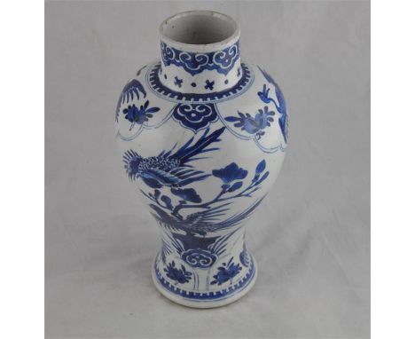 &nbsp;A Chinese late 17th / early 18th century Kangxi period blue and white baluster shape vase, decorated all round with pan