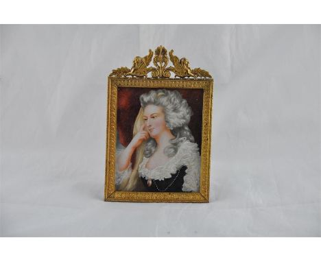 19th Century English School,&nbsp;a portrait miniature of a lady wearing a lace trimmed black dress, with her hand to her che