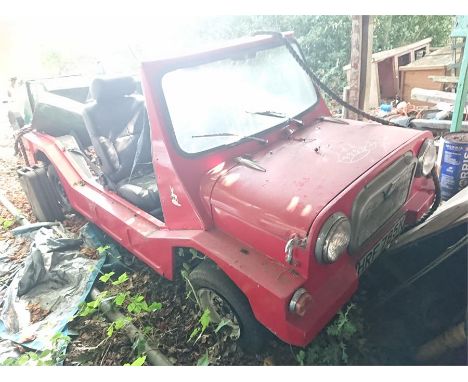 Vintage Red Moke 2 seater vehicle registration HRF 785K (located behind swimming
pool - as found)