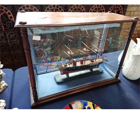 A vintage scratch built model ship, with four masts complete with rigging, the deck with lifeboats over a painted hull, 56cm 