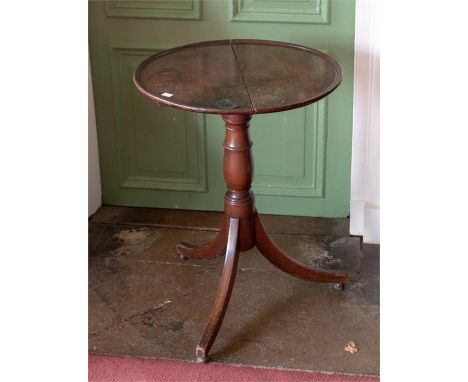 A George III mahogany tripod table, circular dished top, baluster column, sabre base, diameter 50cm