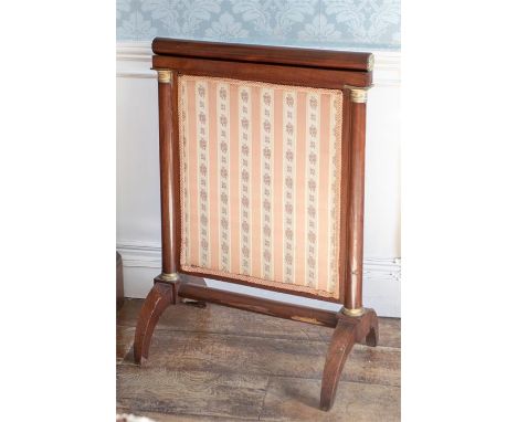 A 19th Century mahogany retractable firescreen of Empire design, brass fittings, width 61cm