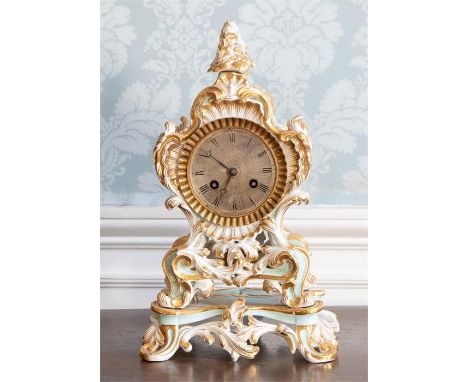 A 19th Century Paris porcelain bracket clock, of Rococo design with gilt decoration, on a plinth, height 36cm (key)