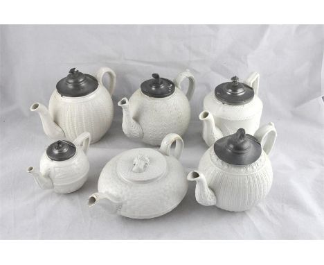 Five assorted Victorian Castleford type teapots with pewter lids, each with moulded decoration to include one by J Dudson, Ar