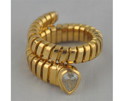 A gold and diamond snake coil ring, having pear drop cut diamond in rub over setting, diamond approx. 0.5 carats, to Tubogas 
