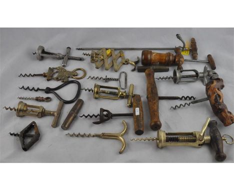 A large collection of 65 corkscrews, to include; two Patent barrel corkscrews&nbsp;with turned ivory handles, two further bar