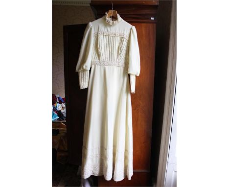 A vintage lace turtle neck full length wedding gown with full length sleeves xxs size