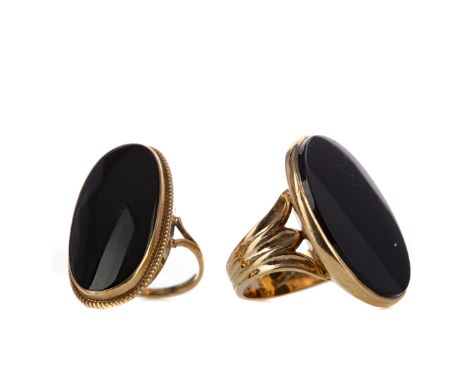 TWO BLACK ONYX RINGS, each in nine carat gold, size N and O, 18.7g gross (2)