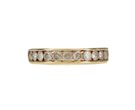 DIAMOND BAND, set with round brilliant cut diamonds totalling approximately 1.00 carat, marked 10K, size O, 2.9g
