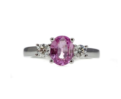 PINK SAPPHIRE AND DIAMOND RING, the central pink sapphire of approximately 1.50 carats flanked by two round brilliant cut dia