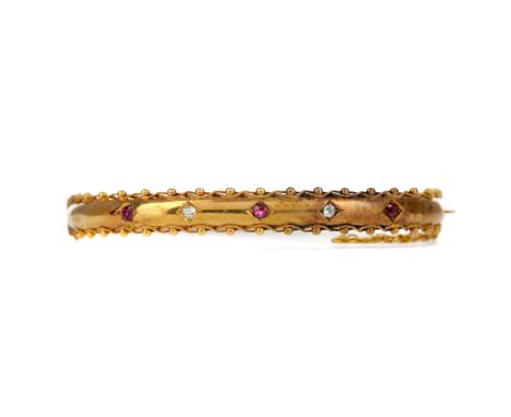 VICTORIAN RED GEM SET AND DIAMOND BANGLE, set with round red gems interspaced by diamonds totalling approximately 0.08 carats
