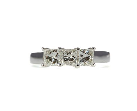 DIAMOND THREE STONE RING, the princess cut diamonds totalling approximately 1.00 carat, in eighteen carat white gold, size L,