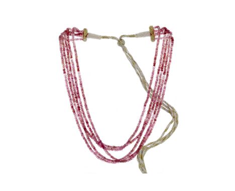 FIVE ROW PINK SPINEL NECKLACE, formed by faceted beads, on an adjustable fabric necklace with pearl decoration