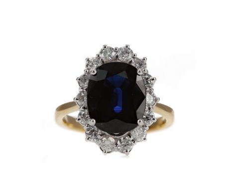 SAPPHIRE AND DIAMOND CLUSTER RING, the oval sapphire of approximately 5.40 carats within a round brilliant cut diamond halo t