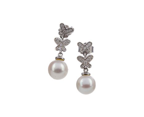 PAIR OF PEARL AND DIAMOND EARRINGS, the pearls 7mm in diameter suspended from diamond set butterfly posts, the diamonds total