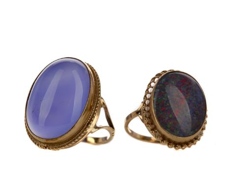 TWO DRESS RINGS, including an opal doublet, in nine carat gold, size Q, along with a purple gem set ring, in nine carat gold,