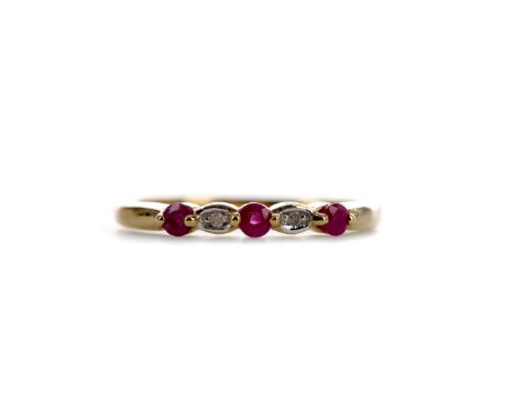 RUBY AND DIAMOND RING, set with round rubies interspaced by illusion set diamonds, in nine carat gold, size L, 1.4g