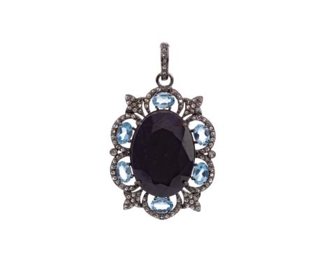 SAPPHIRE AND TOPAZ PENDANT, the faceted sapphire of approximately 30.00 carats, within a border of blue topaz and rose cut di