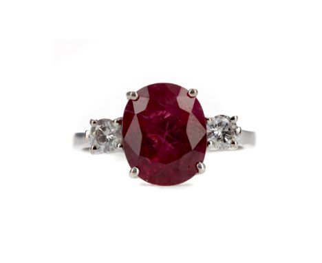 RUBY AND DIAMOND RING, the oval ruby of approximately 4.34 carats flanked by round brilliant cut diamonds totalling approxima