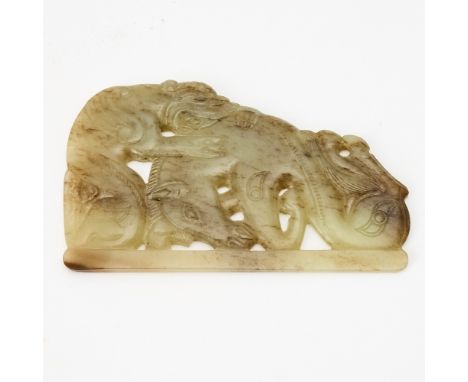 The Han-style mottled jade carving depicts a tiger attacking a horse.(Width 4 1/4 inches)No condition report? Click below to 