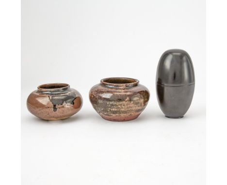 Comprising a Suzuki Mutsumi black lacquer egg form tea caddy, together with two glazed pottery tea containers, one with silk 