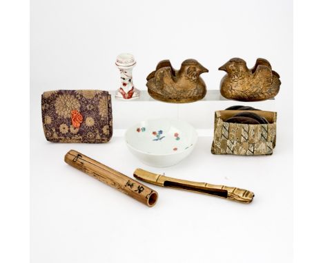 Comprising a kakiemon porcelain dish, a pair of gilt lacquered cast iron screen weights, a bamboo and antler pipe case, a dim