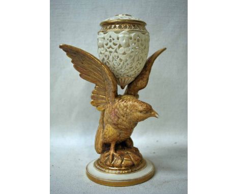 A Grainger &amp; Co Worcester China Pot Pourri as an eagle with outstretched wings supporting a pierced egg shape pomander wi