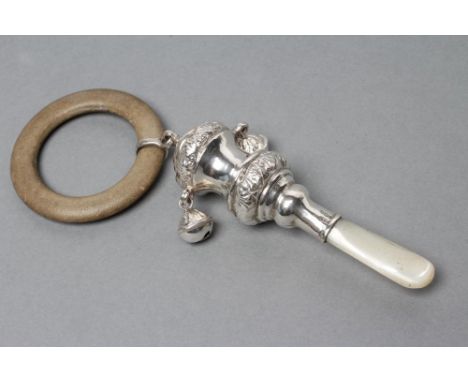 A SILVER RATTLE, maker Crisford & Norris, Birmingham 1938, the spool finial with foliate chased rims, hung with two bells and