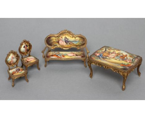 AN AUSTRIAN GILT METAL AND ENAMEL MINIATURE BOUDOIR SET, painted in colours with figures in 18th century garb at a fete champ