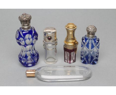 A COLLECTION OF GEORGIAN AND LATER GLASS SCENT BOTTLES, comprising "Le Parisien"- a ruby overlay cylindrical bottle with pate