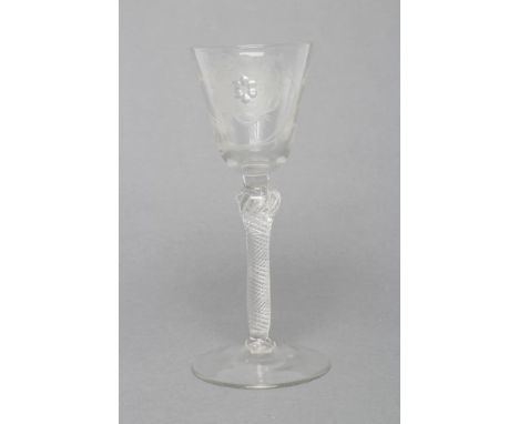 A JACOBITE WINE GLASS, mid 18th century, the round funnel bowl engraved with a rose and star, on shoulder knop and multi spir
