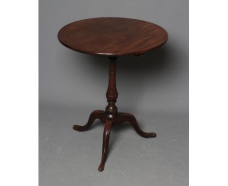 A GEORGIAN MAHOGANY TRIPOD TABLE, late 18th century, the circular tip-up top on ring turned vase stem, and cabriole legs with