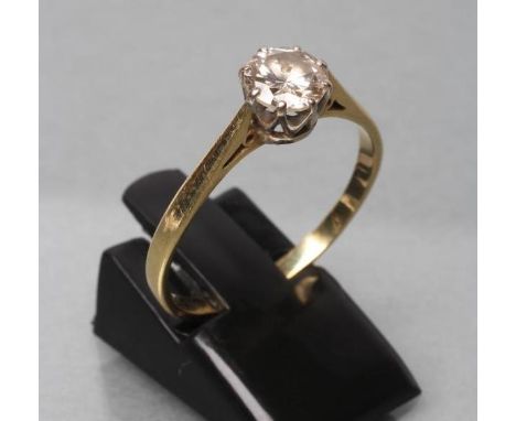 A SOLITAIRE DIAMOND RING, the old brilliant cut stone of approximately 0.80cts, claw set to a plain 18ct gold shank, size U 1