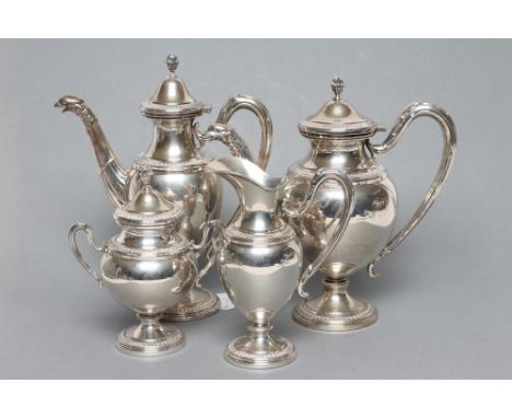 AN ITALIAN FOUR PIECE EMPIRE STYLE TEA SET, stamped 800, of pedestal vase form with stiff leaf stamped rims, comprising teapo