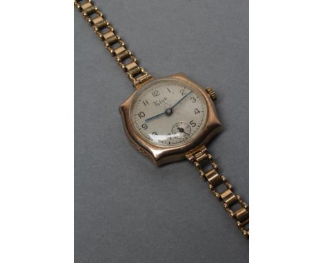 A LADY'S 9CT GOLD WRISTWATCH, the silvered dial with black Arabic numerals enclosing subsidiary seconds dial and inscribed Fe