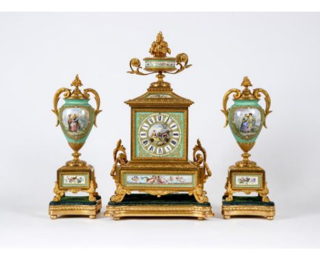 A FRENCH GILT METAL AND INSET PORCELAIN CLOCK GARNITURE,19th century, the Japy Freres twin barrel movement striking on a bell