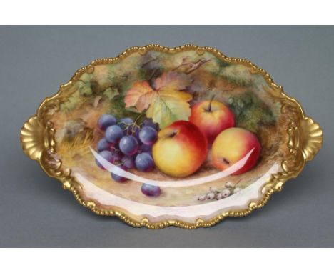 A ROYAL WORCESTER CHINA LOW PEDESTAL DISH, 1930, of lobed oval form with two escallop shell lug handles, painted in polychrom