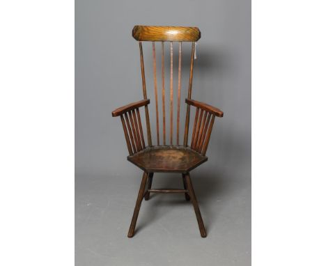 A COMB BACK WINDSOR ARMCHAIR, in the Arts & Crafts style, c.1900, with curved top rail, shaped splayed arms, dished hexagonal