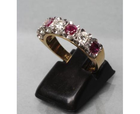 A RUBY AND DIAMOND HALF HOOP ETERNITY RING, the three rubies and three diamonds point set to a plain 18ct gold shank, Birming