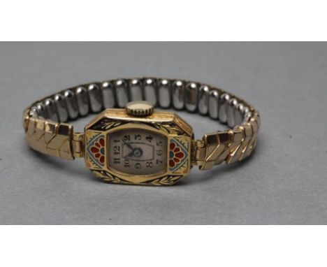 A LADY'S 18CT GOLD WRISTWATCH, the oblong silvered dial with black Arabic numerals, jewelled movement in a shaped case with c
