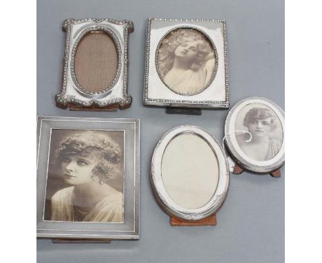 A COLLECTION OF FIVE EASEL BACK PHOTOGRAPH FRAMES, comprising two oval, Chester 1919, 6 1/4" high, and Birmingham 1946, 5 1/2