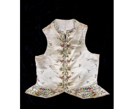 A REGENCY GENTLEMAN'S CREAM SILK WAISTCOAT, c.1790, embroidered in coloured silks with flower heads and scattered sprays, wit