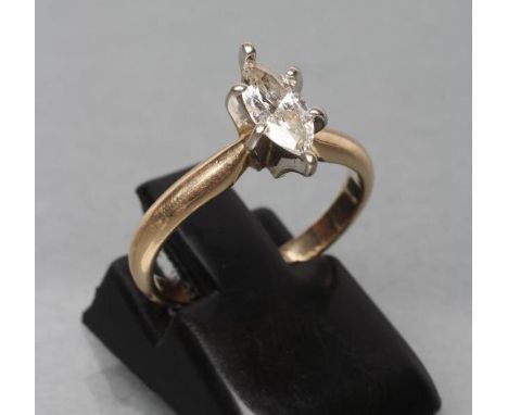 A SOLITAIRE DIAMOND RING, the marquise cut stone of 0.46cts claw set to a plain shank, stamped 14k, size H 1/2 (Est. plus 21%