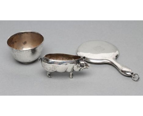 A NOVELTY SILVER PIN CUSHION, maker Adie & Lovekin Ld., Birmingham date letter rubbed, modelled as a pig, 2 3/4" long, togeth