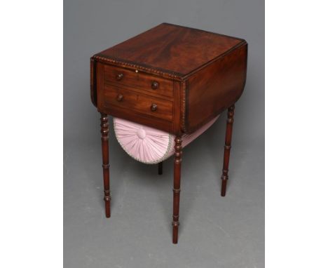 A REGENCY MAHOGANY AND ROSEWOOD BANDED WORK TABLE, the rounded oblong top with bead and reel edging, two frieze drawers over 