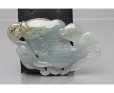 A JADE PENDANT, the flat panel carved and pierced as a fish, on an unmarked loop (Est. plus 21% premium inc. VAT)40.6g, 7.2 x